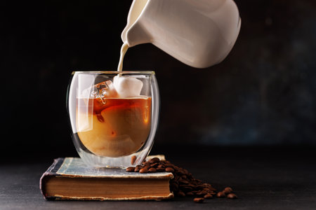 Iced cold brew coffee and freshly roasted coffee beans. With copy spaceの写真素材