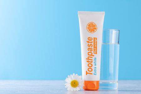 A clean and refreshing image featuring toothpaste tube, promoting oral hygiene and a bright smile