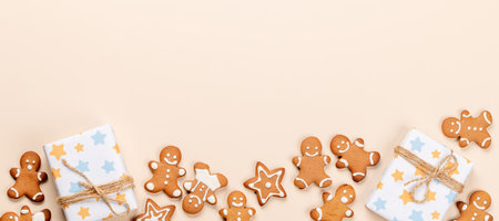 Christmas gift boxes, gingerbread cookies and space for Xmas greetings text. flat layの写真素材