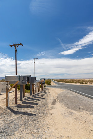 Many mailboxes along the road, representing the sense of community and connection through...
