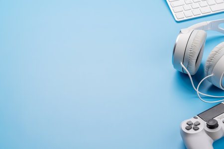 Gaming gear and tech accessories on a blue background, perfect for gaming and tech-related themes....