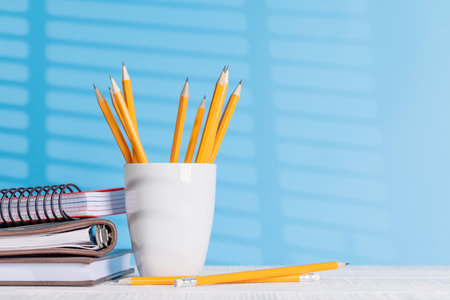 An organized arrangement of pencils and notepads on an office desk, offering ample copy space for your creative ideas or textの写真素材