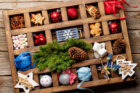Wooden box with Christmas decor and toys. flat layの写真素材