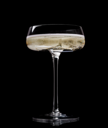 Champagne glass on a black backgroundの写真素材
