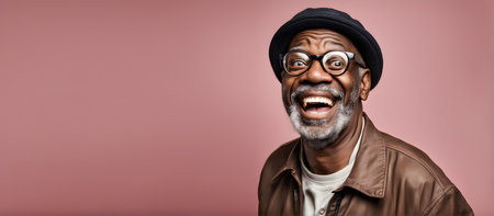 Smiling elderly Black man on plain background with copy spaceの素材