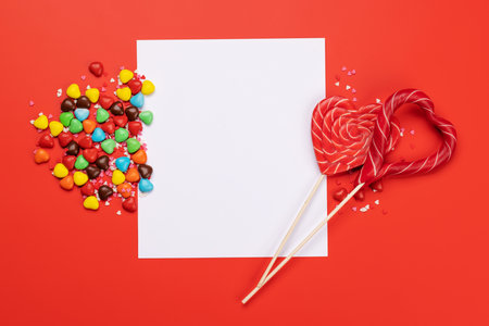 Candy sweets and blank greeting card for your greetings. Valentines day candy hearts. flat layの写真素材