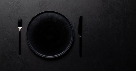 Mockup for a delicious meal. Empty plate on a table. Flat lay with copy spaceの写真素材