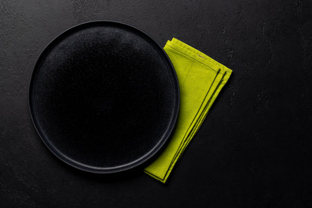 Mockup for a delicious meal. Empty plate on a table. Flat lay with copy spaceの写真素材