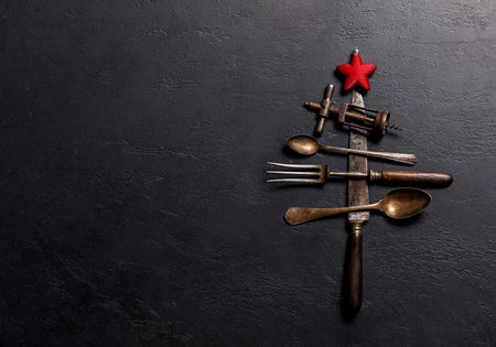 Festive culinary flair: Christmas tree-shaped cooking utensils. Flat lay with copy spaceの写真素材
