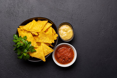 Mexican food featuring nachos. Flat lay with copy space