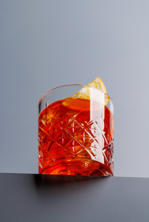 Cocktail delight: Classic negroni against a gray background with copy space