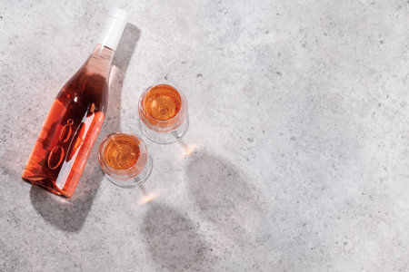 Refreshing rose wine by the pool on a sunny day, the perfect summer vacation. View from above with space for your textの写真素材