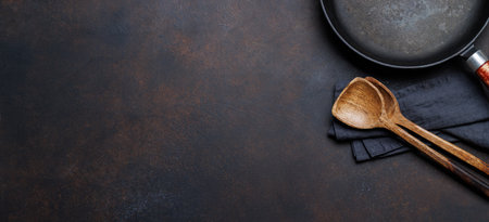 Culinary essentials: Diverse cooking utensils on stone table. Flat lay with copy spaceの写真素材