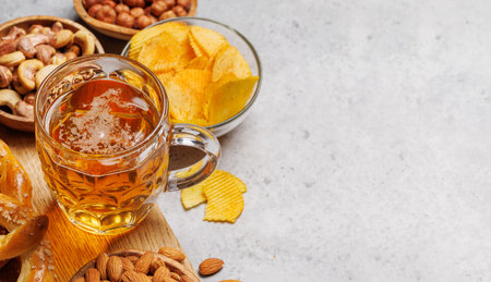 Assorted Beer Stands: chips, nuts, pretzels. Diverse Options for Refreshment with copy spaceの写真素材