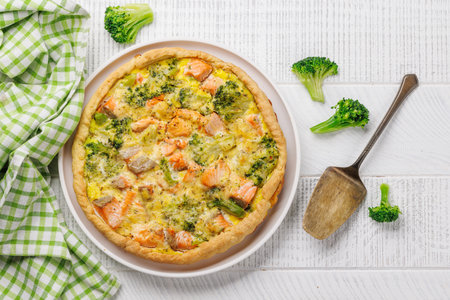 Fresh fish homemade pie with salmon and broccoli. Flat layの写真素材