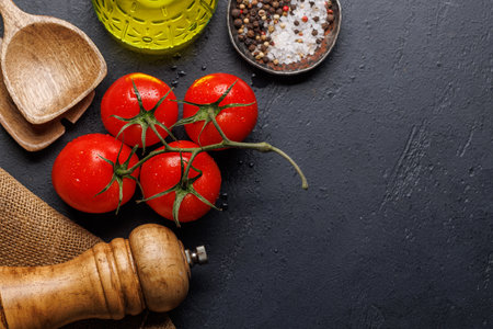Spices, olive oil, ingredients and utensils on cooking table. Flat lay with copy spaceの写真素材