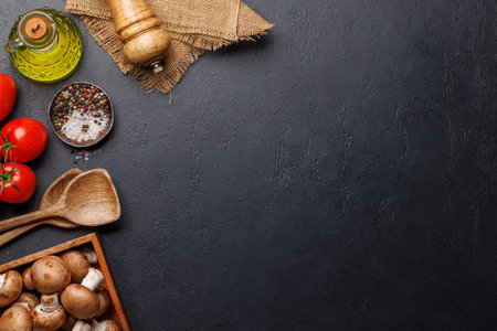Spices, olive oil, ingredients and utensils on cooking table. Flat lay with copy spaceの写真素材