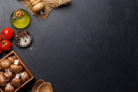 Spices, olive oil, ingredients and utensils on cooking table. Flat lay with copy spaceの写真素材