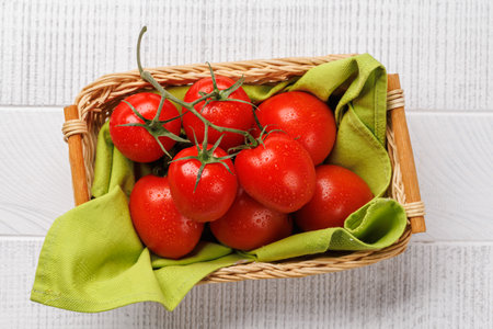 Fresh tomatoes in basket. Flat layの写真素材