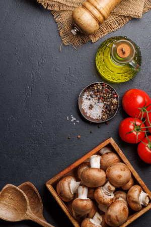 Spices, olive oil, ingredients and utensils on cooking table. Flat lay with copy spaceの写真素材