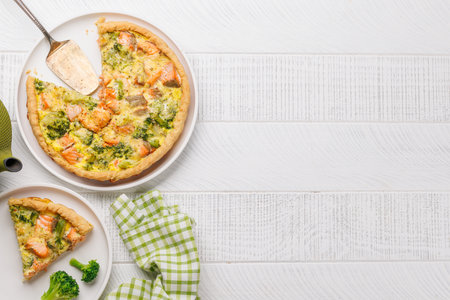 Fresh fish homemade pie with salmon and broccoli. Flat lay with copy spaceの写真素材