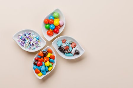 Various colorful candies, lollipops. Flat lay with copy space