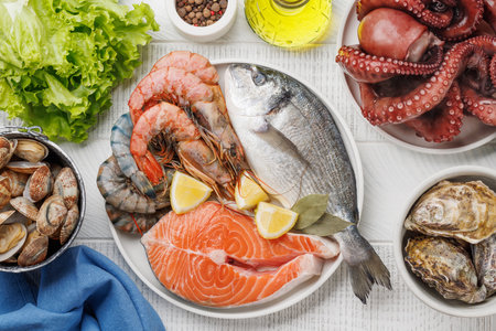 Seafood Platter Delight: Shrimps, Salmon, Oysters Galore. Flat layの写真素材