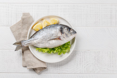 Fresh dorado fish, ready to cook. Flat lay with copy spaceの写真素材