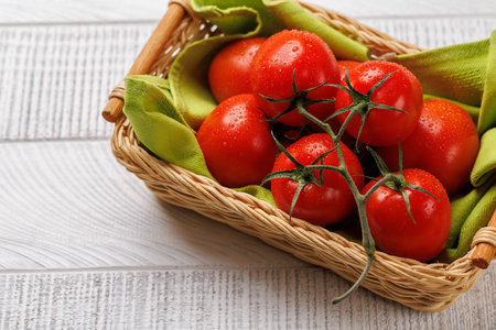 Fresh tomatoes in basket. Flat layの写真素材