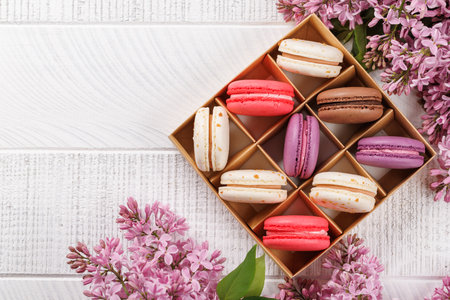 Colorful macaroons in box, arranged in a delightful display of vibrant hues and irresistible sweetnessの写真素材