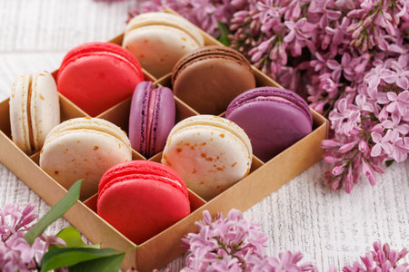 Colorful macaroons in box, arranged in a delightful display of vibrant hues and irresistible sweetnessの写真素材