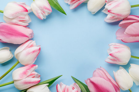Pastel colorful tulips grace the table, providing a serene and vibrant backdrop, perfect for spring celebrations or simple joysの写真素材