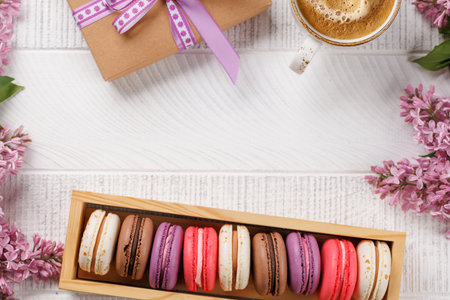Colorful macaroons in box, arranged in a delightful display of vibrant hues and irresistible sweetness with copy spaceの写真素材