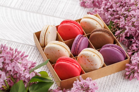 Colorful macaroons in box, arranged in a delightful display of vibrant hues and irresistible sweetnessの写真素材