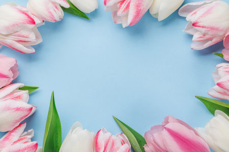 Pastel colorful tulips grace the table, providing a serene and vibrant backdrop, perfect for spring celebrations or simple joysの写真素材