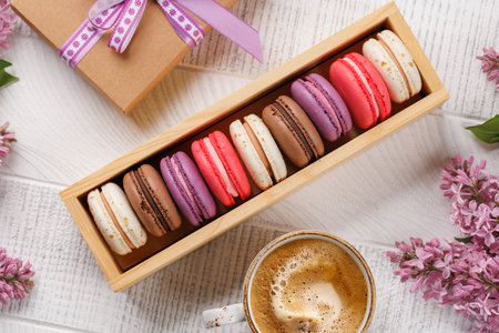 Colorful macaroons in box, arranged in a delightful display of vibrant hues and irresistible sweetnessの写真素材
