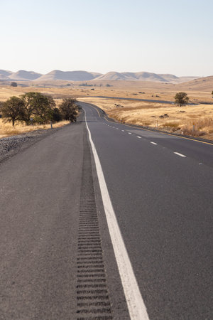 Asphalt road and countryside landscape of United Statesの写真素材