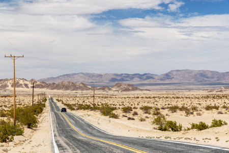 The perspective of a never-ending road, the journey of travel and adventure towards a beautiful destinationの写真素材