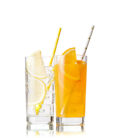 Various lemonade with ice in glasses isolated on whiteの写真素材