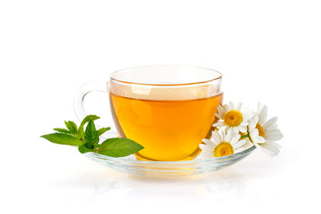 Soothing herbal tea blend with mint and chamomile. Isolated on white backgroundの写真素材