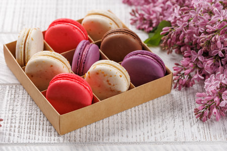 Colorful macaroons in box, arranged in a delightful display of vibrant hues and irresistible sweetnessの写真素材