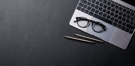Office desk table with laptop computer and supplies. Top view with copy space. Flat layの写真素材