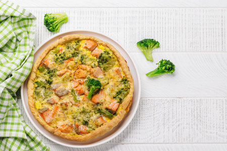 Fresh fish homemade pie with salmon and broccoli. Flat lay with copy spaceの写真素材