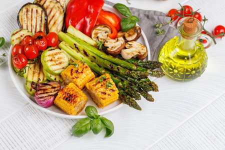 Assorted grilled vegetables on a plate, showing a colorful and healthy meal. With copy spaceの写真素材