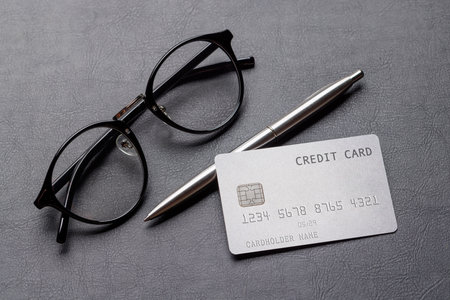 Credit card on office table with supplies. Banking conceptの写真素材