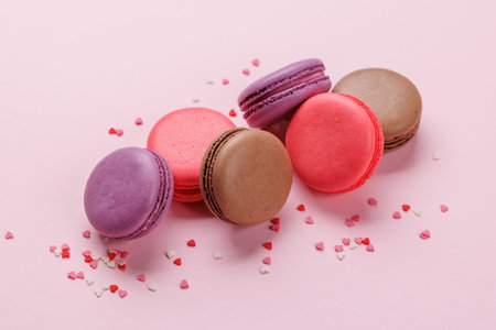 Various colorful macaroons. Love sweets over pink backgroundの写真素材