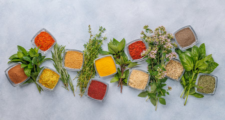 Various herbs and spices on the table, adding vibrant colors and rich aromas to the kitchenの写真素材