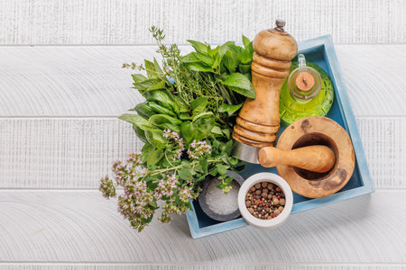 Various herbs and spices on the table, adding vibrant colors and rich aromas to the kitchenの写真素材