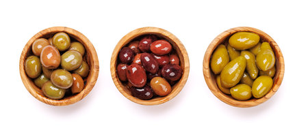 An assortment of various olives presented in a bowl, showing different colors, textures, and flavors. Isolated on white backgroundの写真素材