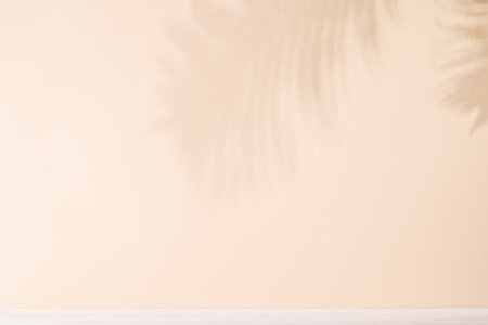 Template with empty table and wall with leaves shadow, perfect for product presentation and mockup